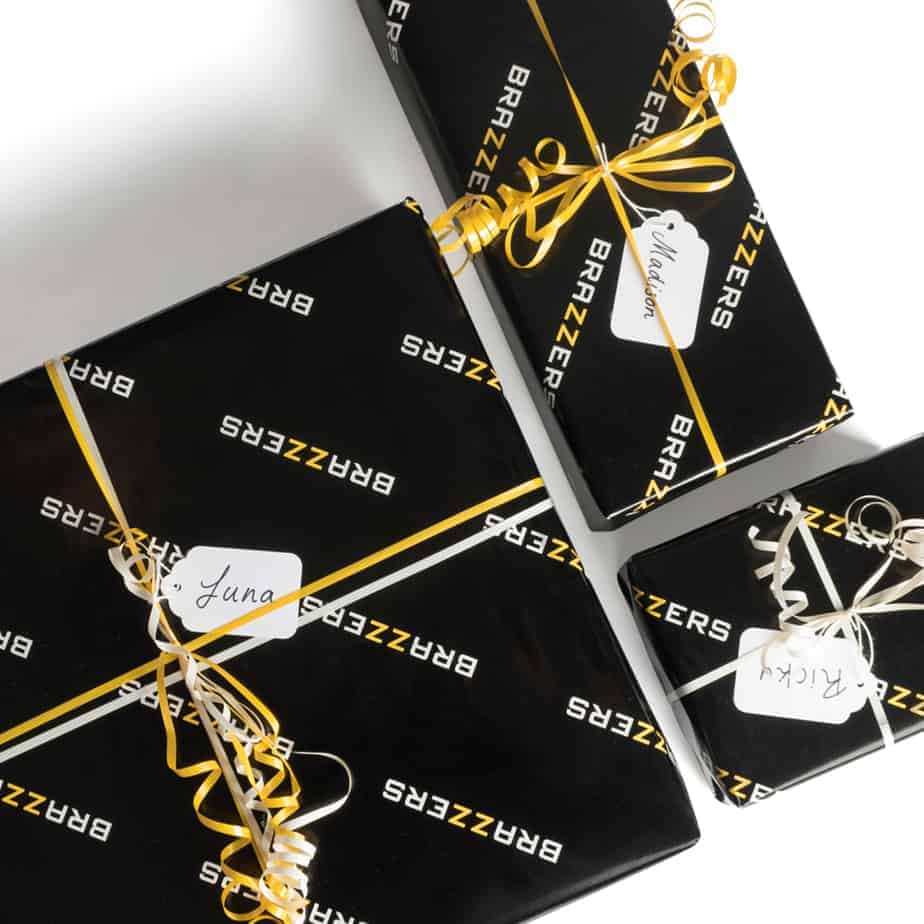 Brazzers Black Gift Wrapping Paper with Brazzers logo all over it written in white and yellow (ZZ) lettering.